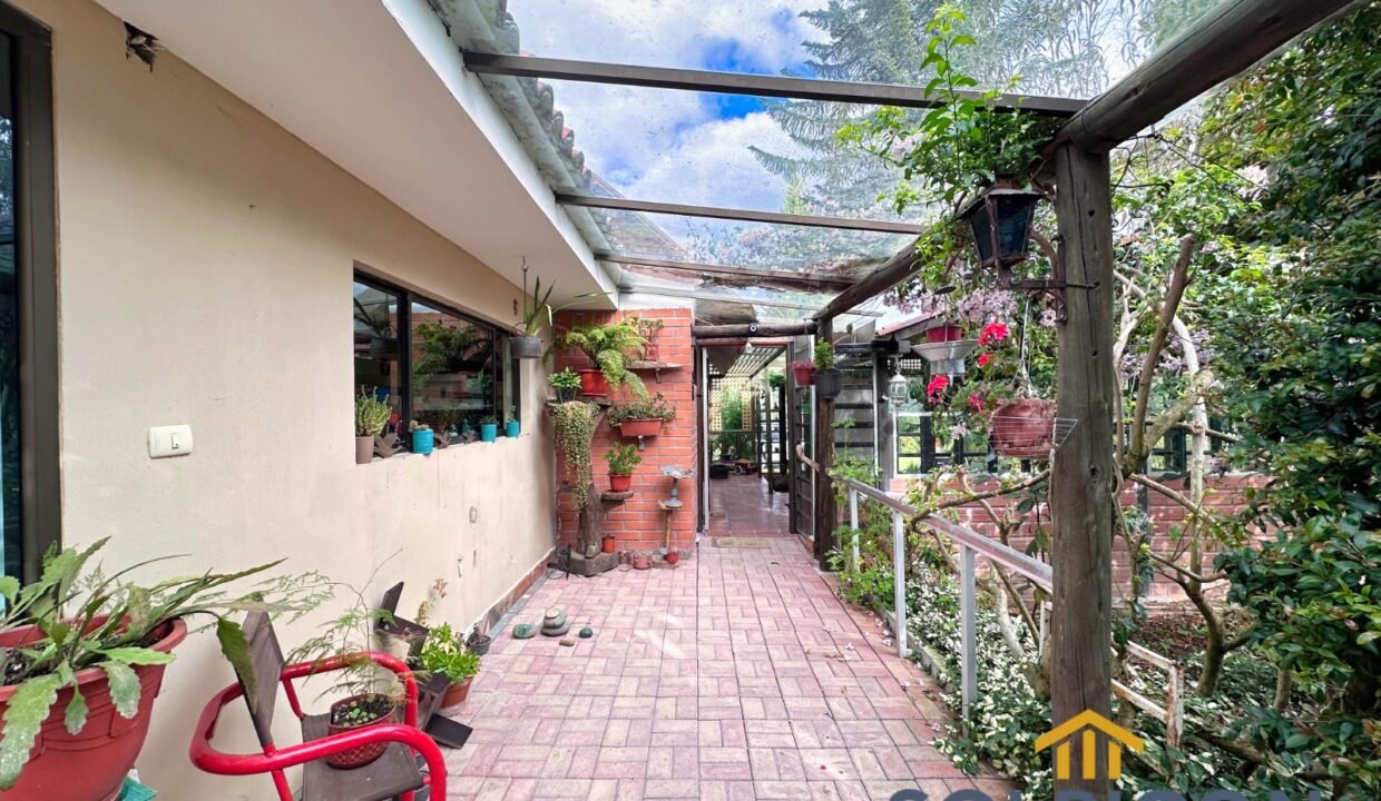 pasillo fachada Casa de campo Zhullin Alto